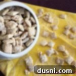 Zesty Cereal Crunch 2 Overhead view of homemade Lemonade Chex Mix in a pristine white bowl, ready to serve