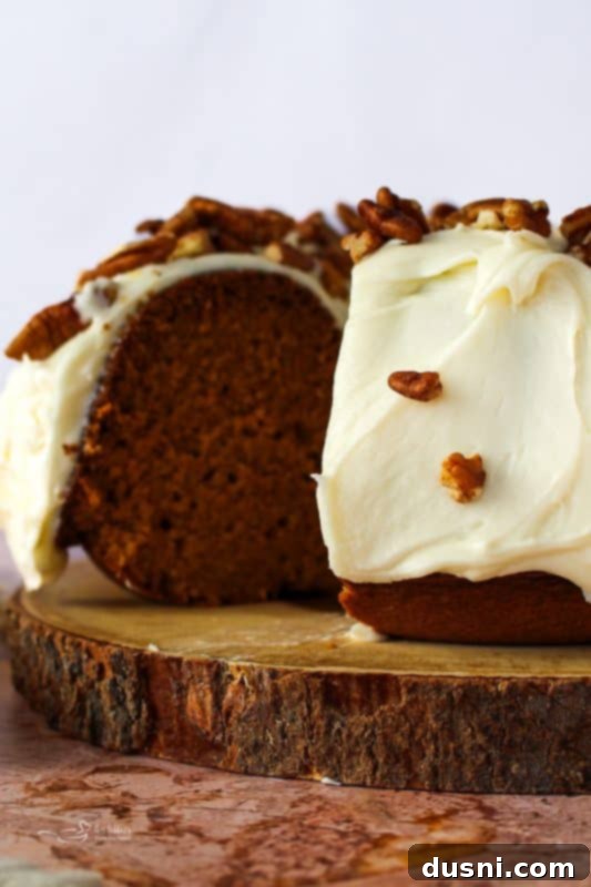 Moist Pumpkin Bundt Cake with Cream Cheese Frosting and Toasted Pecans