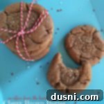 Overhead of cookies on a blue plate with text "Chewy Brown Butter Gingersnaps"