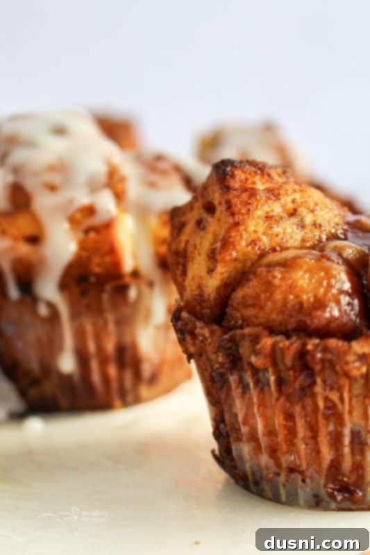 Stacked Toffee Monkey Bread Muffins with a sticky glaze
