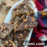 Homemade Graham Cracker Toffee 7 broken up pieces of graham cracker toffee with pecans