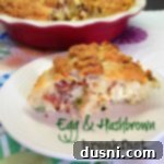 Egg & Hashbrown breakfast pie in a ceramic pie pan and a slice of the pie on a white plate both on a multi colored table cloth.