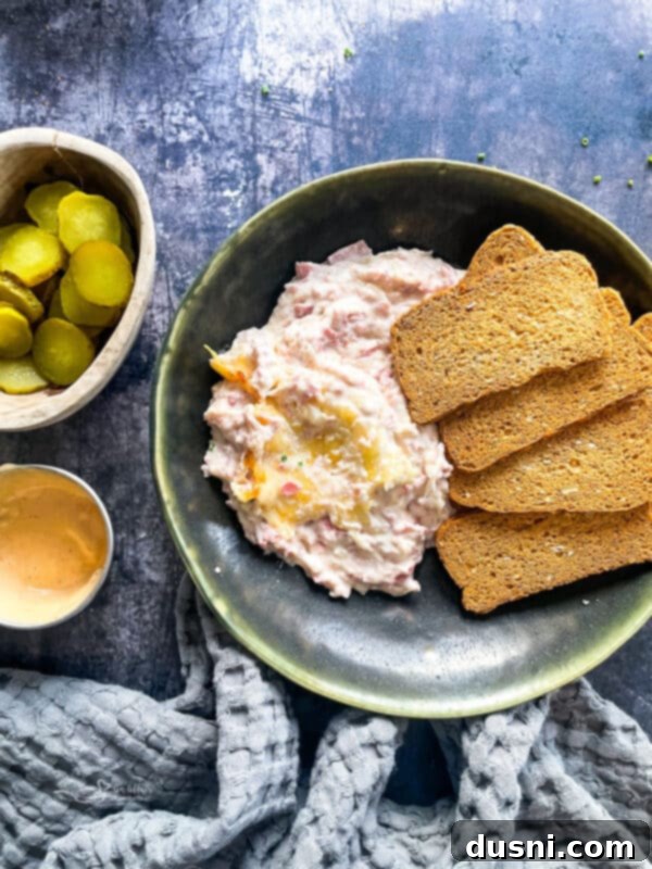 Indulgent Cream of Reuben Soup 15 Crock Pot Reuben Dip served in a small crock pot with rye bread pieces