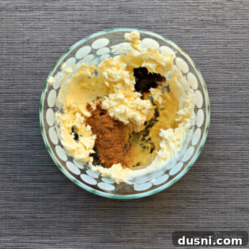 Creaming softened butter in a mixing bowl