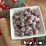 Sugared Cranberries in a white serving dish with frosted details