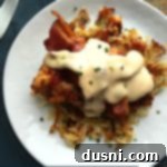 Overhead of Cowboy Chicken on a white plate with text "cowboy chicken"