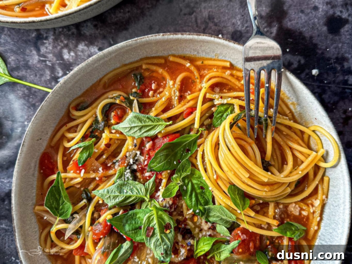 Close up of a fork twirling the pasta in a bowl of Italian Wonder Pot.