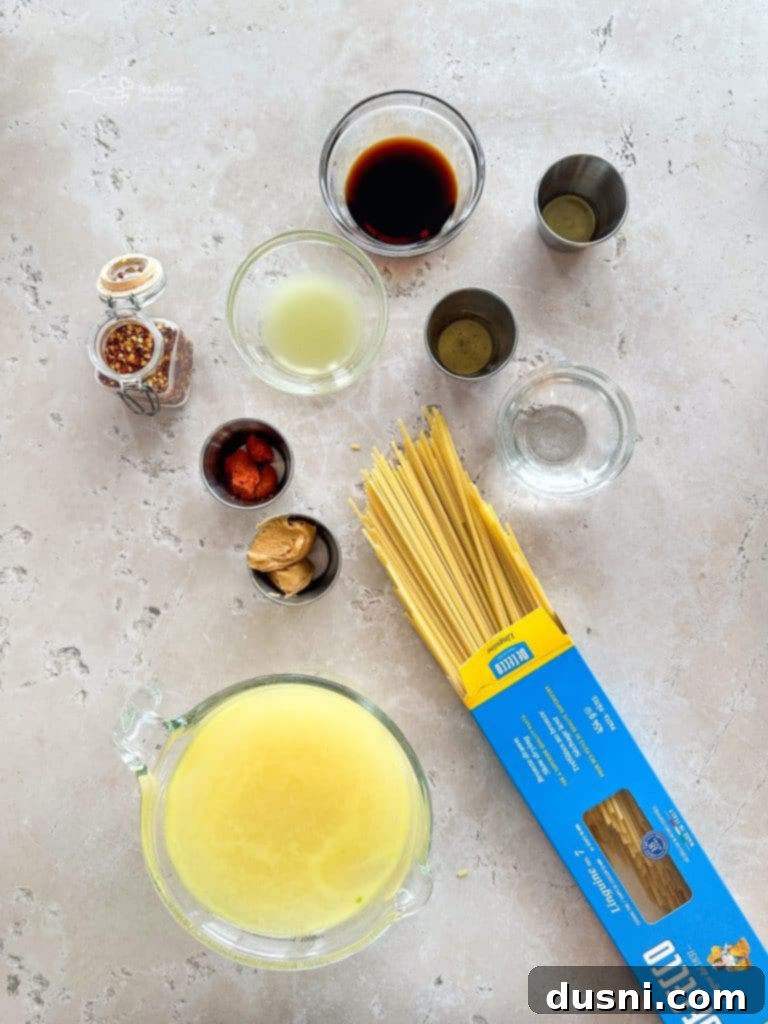 Prepared ingredients for Pad Thai, including chopped vegetables, shrimp, and noodles.