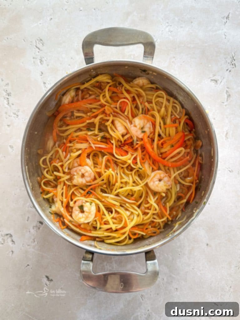 A serving of One-Pot Pad Thai Wonderpot in a bowl, garnished and ready to eat.