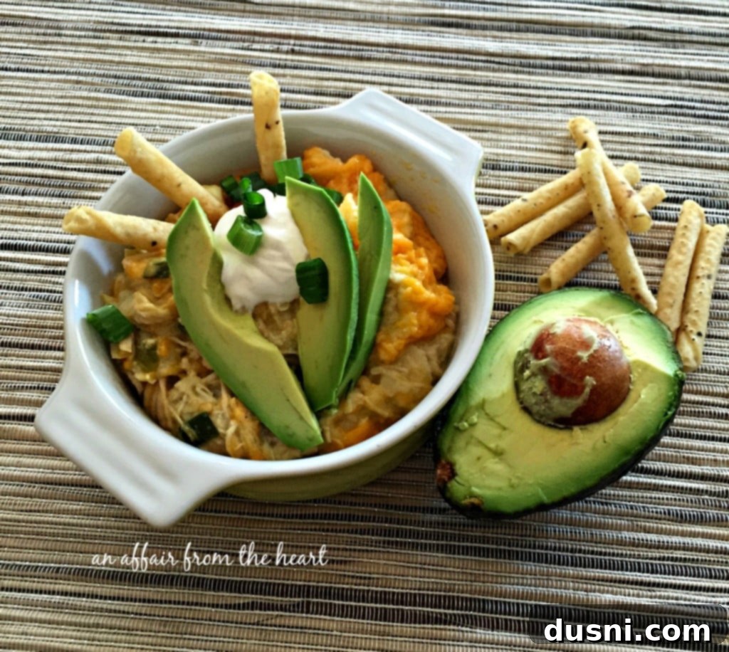 Slow cooker Green Chile Chicken Enchilada Casserole - An easy, comforting Mexican-inspired meal.