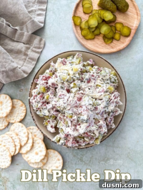 Zesty Dill Pickle Dip 13 Dill Pickle Dip served beautifully on a platter with crackers and fresh dill