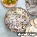 Zesty Dill Pickle Dip 15 Dill Pickle Dip in a bowl surrounded by crackers