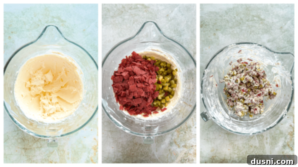 Zesty Dill Pickle Dip 8 A hand mixer whipping cream cheese in a bowl