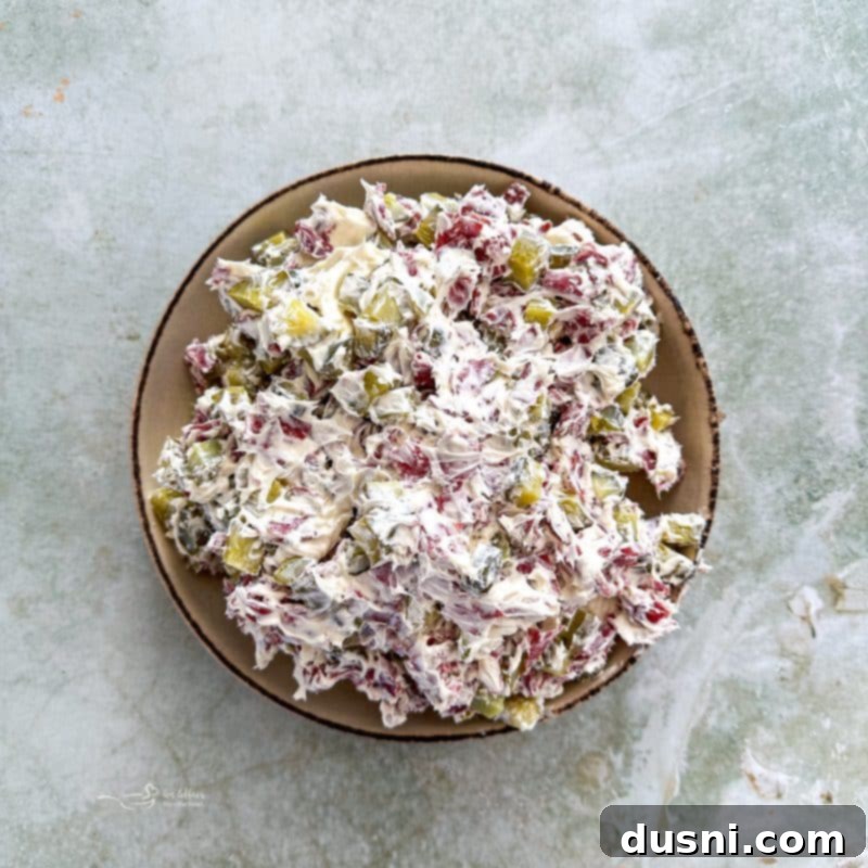 Zesty Dill Pickle Dip 9 Finished Dill Pickle Dip garnished with fresh dill in a bowl