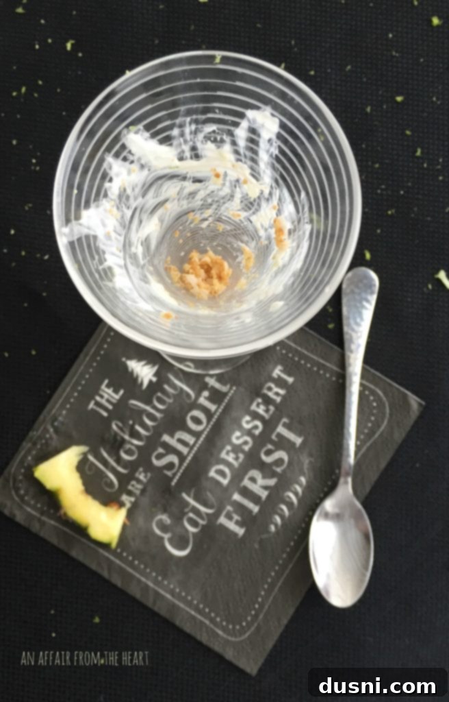 Empty glass after enjoying Pina Colada Cheesecake Shooter, emphasizing deliciousness