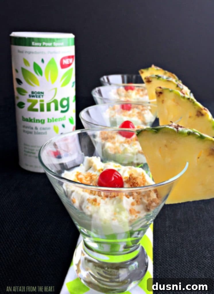Individual No Bake Pina Colada Cheesecake in a martini glass