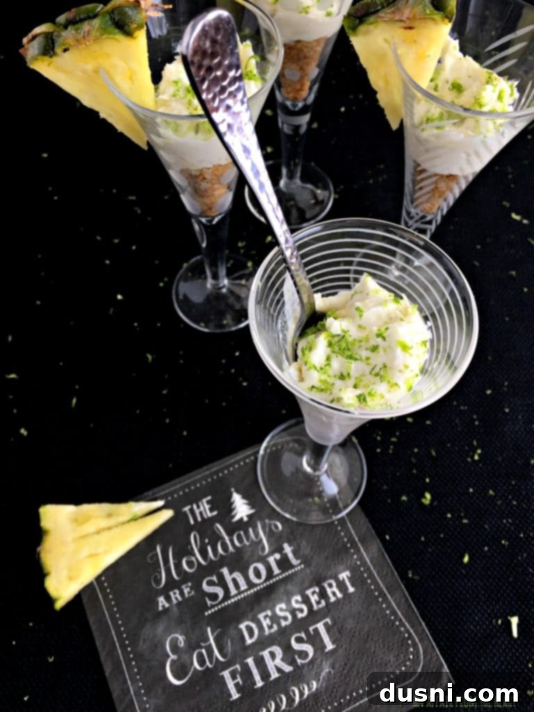 Pina Colada Cheesecake Shooters garnished with lime zest