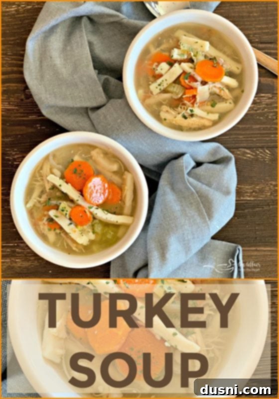 A beautifully presented bowl of Turkey Noodle Soup with a rustic spoon, ready to be enjoyed.