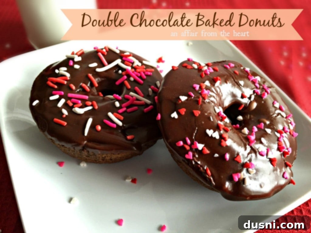 Delicious Double Chocolate Baked Donuts with glaze and sprinkles on a white plate