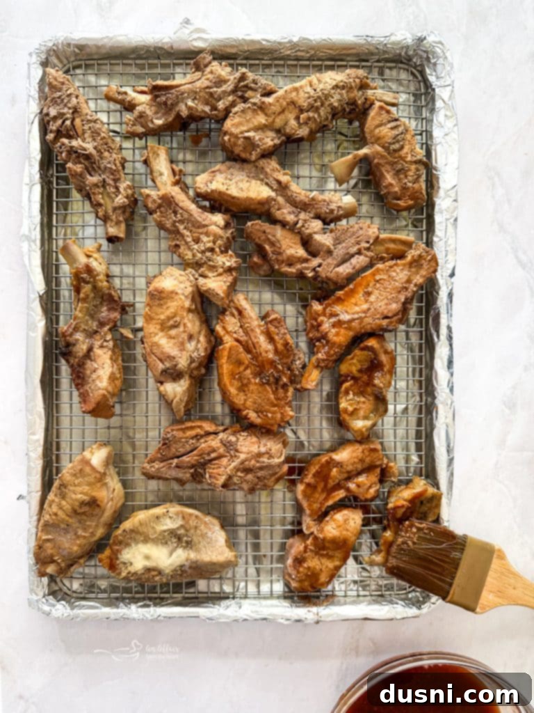 Mixing BBQ sauce with Dr. Pepper soda in a bowl