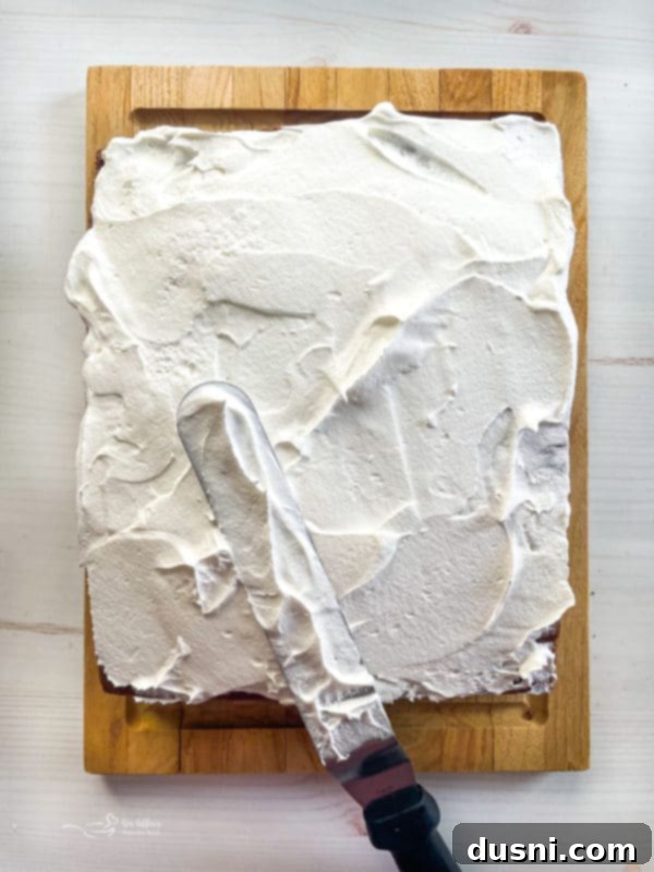 Black Forest Cake frosting black forest cake with spatula