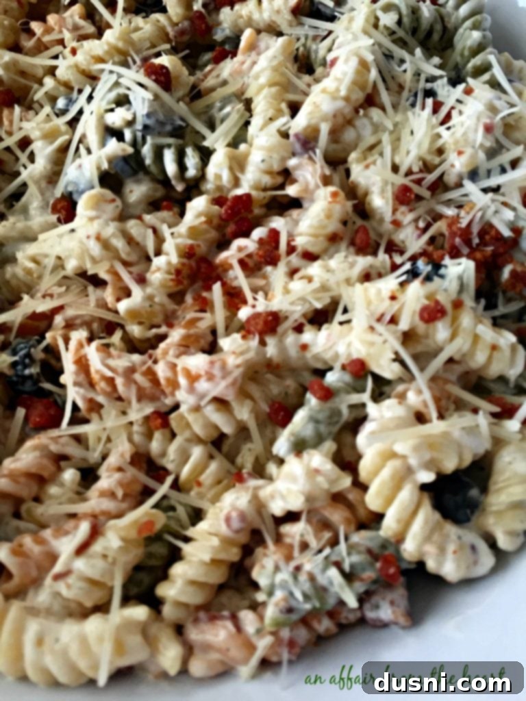 Creamy Ranch Pasta Salad with Bacon 3 Close-up of vibrant Creamy Bacon & Ranch Pasta Salad with tri-colored rotini