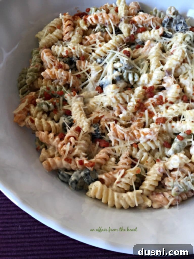 Creamy Ranch Pasta Salad with Bacon 4 Individual serving of Creamy Bacon & Ranch Pasta Salad in a small white bowl