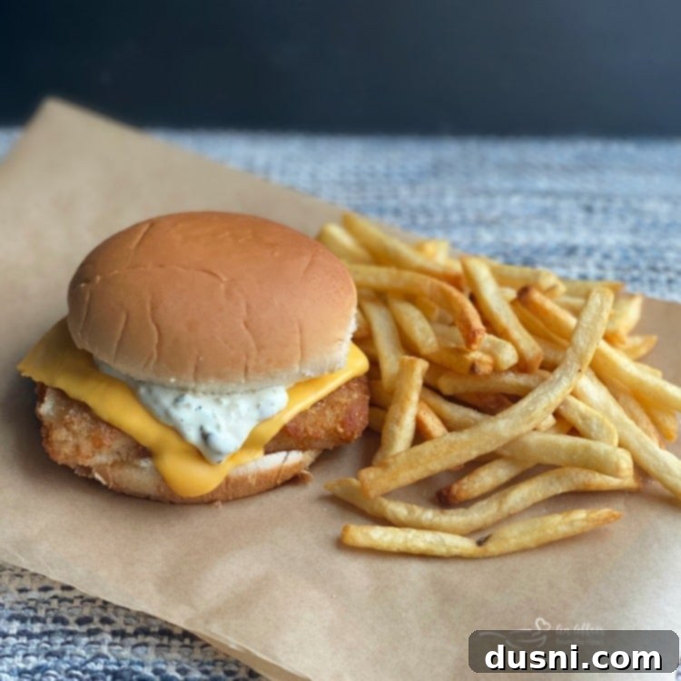 Your Favorite Filet-O-Fish & McDonald's-Inspired Tartar Sauce, Made At Home 20 Side view of Copy Cat McDonald's Fish Sandwich and Tartar Sauce recipe on a plate