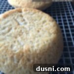 Rustic Farmhouse Loaf 8 Two perfectly golden-brown loaves of homemade Peasant Bread cooling on a wire rack.