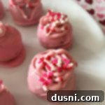 No-Bake Oreo Truffle Delights 8 Close up of Oreo Truffles on a white plate