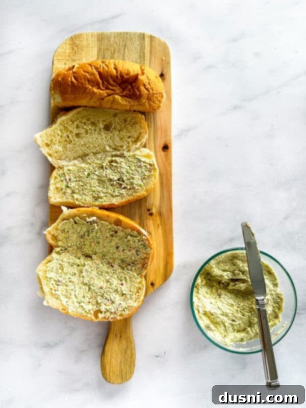 Hoagie roll sliced lengthwise and spread with the bacon veggie spread.