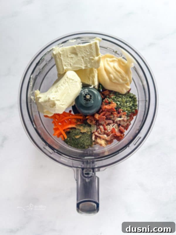 Food processor blending the spread ingredients.