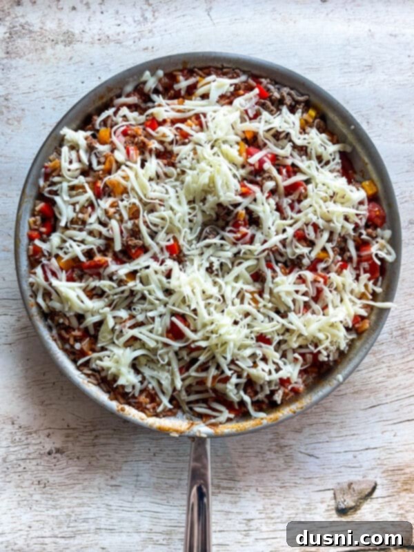 One-Pan Stuffed Peppers 7 Stuffed Pepper Skillet topped with shredded cheese before melting