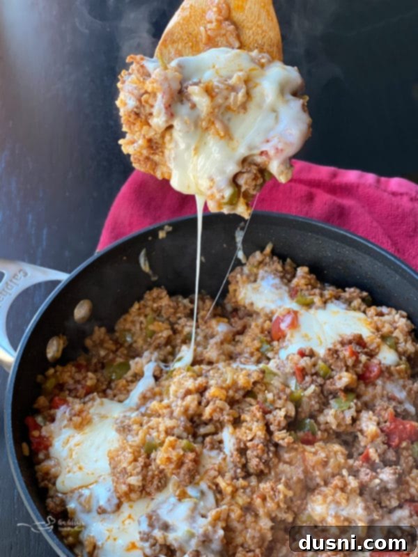 One-Pan Stuffed Peppers 10 A serving of Stuffed Pepper Skillet with a cheese pull
