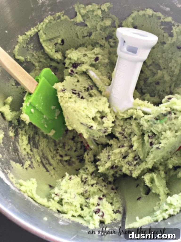 Unbaked green cookie dough balls ready for the oven