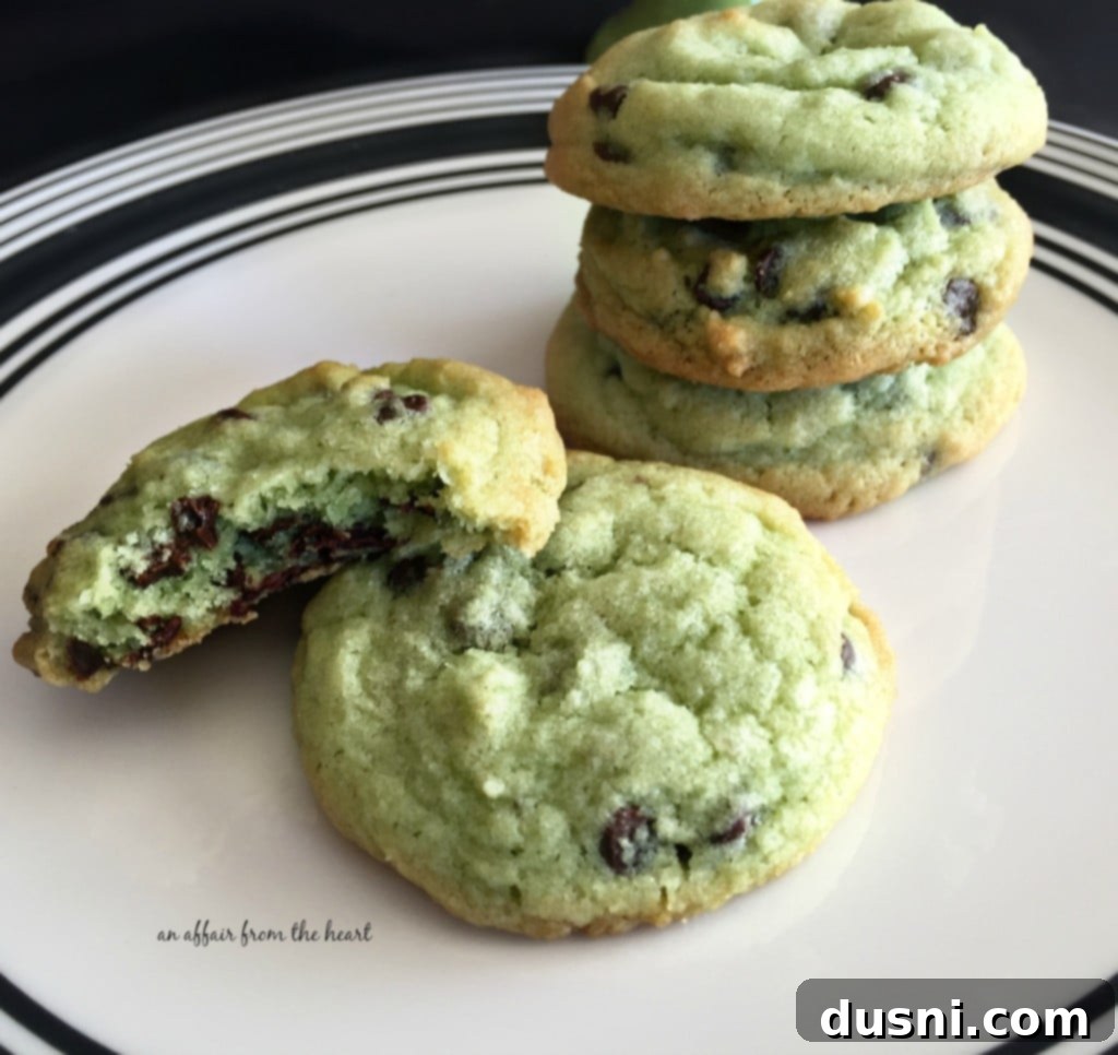 A stack of Mint Chocolate Chip Cookies on a plate, ready to be enjoyed