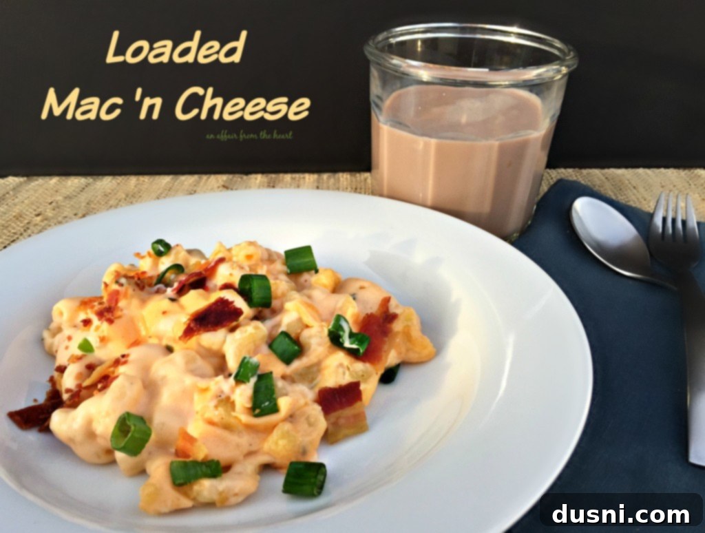 Close-up of a single serving of Loaded Mac 'n Cheese, perfectly topped with green onions and bacon