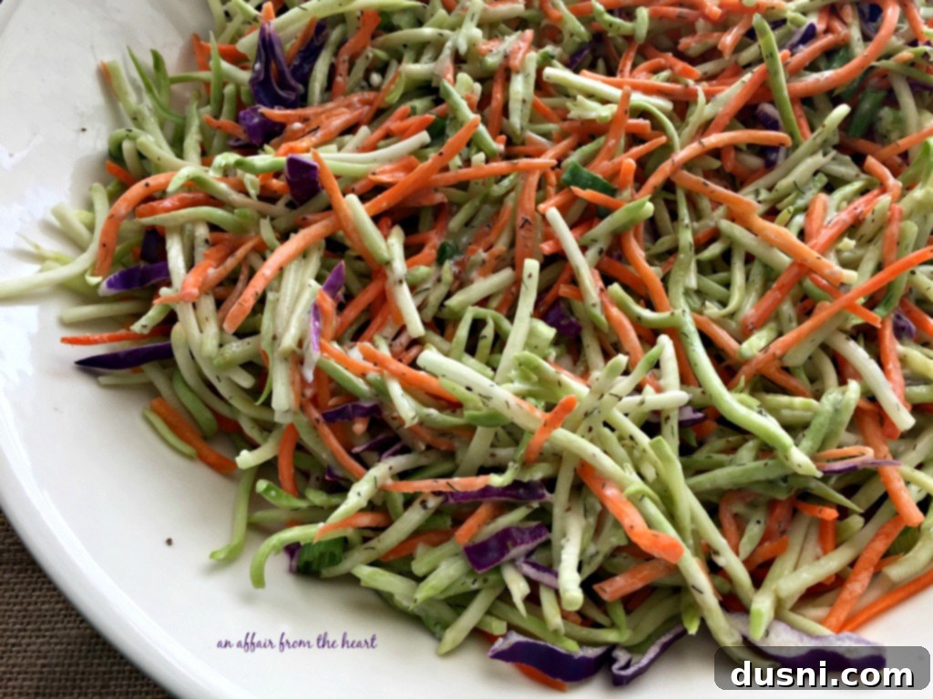 Close-up of fresh broccoli slaw mix with shredded carrots