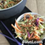 Appetizing Broccoli Slaw with sunflower seeds in a white bowl