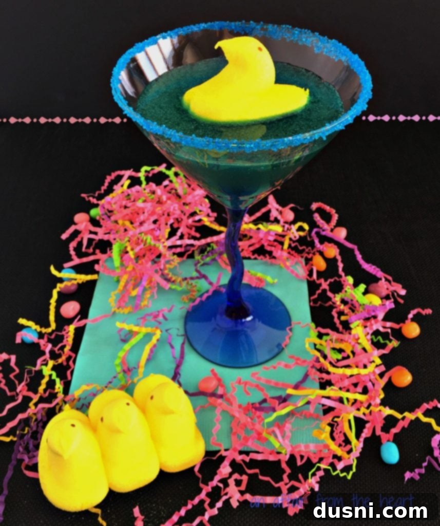 PEEP Tart Martini: A vibrant blue cocktail with a Peep chick garnish