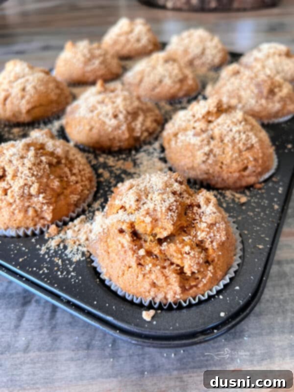 Close up of Pumpkin Spice Banana Muffins in a muffin tin