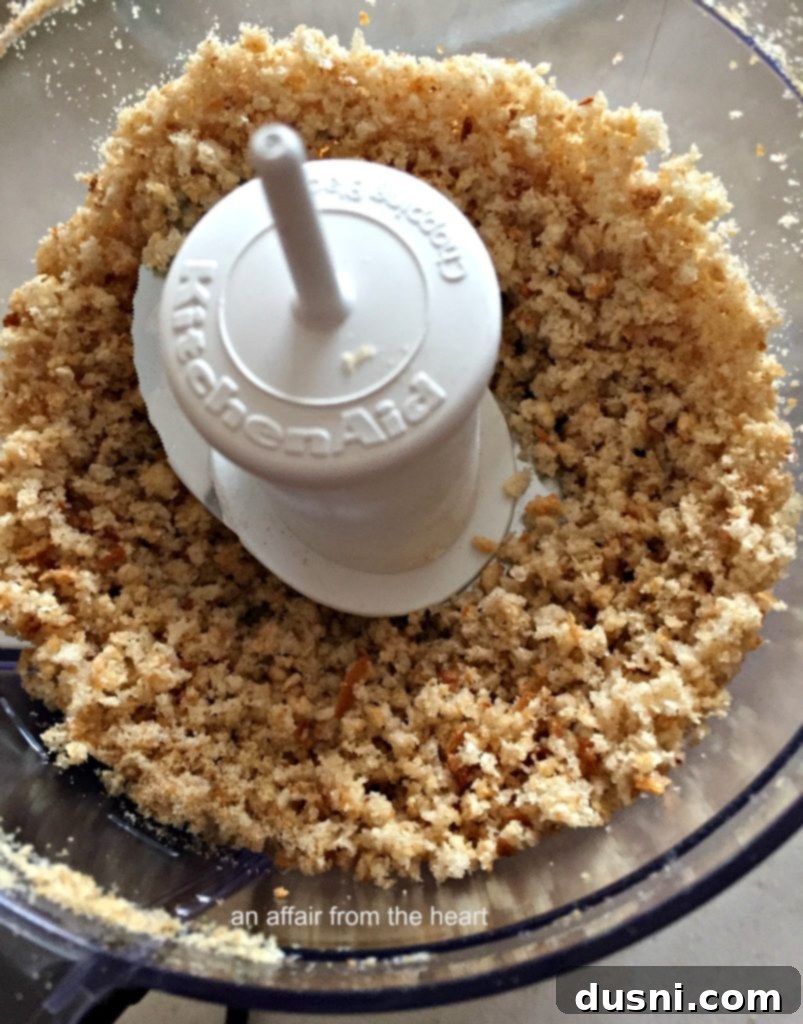 A mix of Reuben Casserole ingredients combined with creamy sauce before baking, highlighting the noodles, corned beef, and sauerkraut