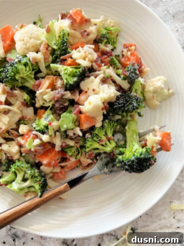 Vibrant Italian Garden Salad 4 Close-up of Italian Raw Veggie Salad in a glass bowl, showcasing the fresh ingredients and creamy dressing.
