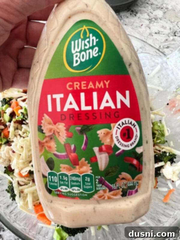 Vibrant Italian Garden Salad 5 A serving of Italian Raw Veggie Salad in a small white bowl, garnished with fresh parsley.