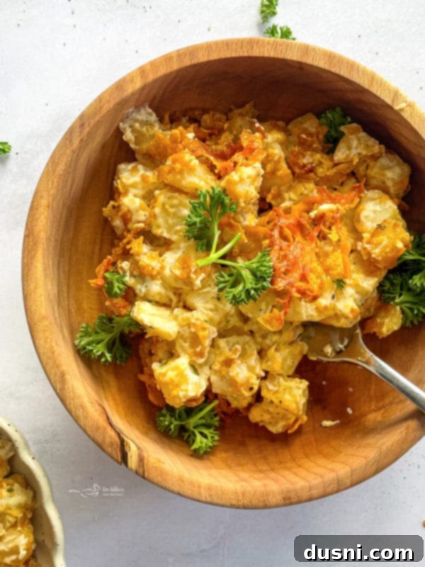 Golden Cheesy Hash Brown Bake 2 Cheesy Hash Brown Potato Casserole Served In A Bowl - a truly satisfying comfort food