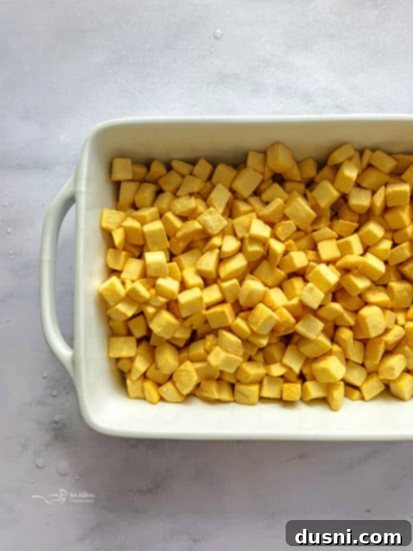 Golden Cheesy Hash Brown Bake 5 Place thawed hash browns in a large bowl. - first step of the recipe