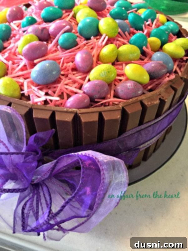 Kit Kat Easter Basket Cake 8 Side view of Easter Basket Kit Kat Cake with a purple ribbon around it.