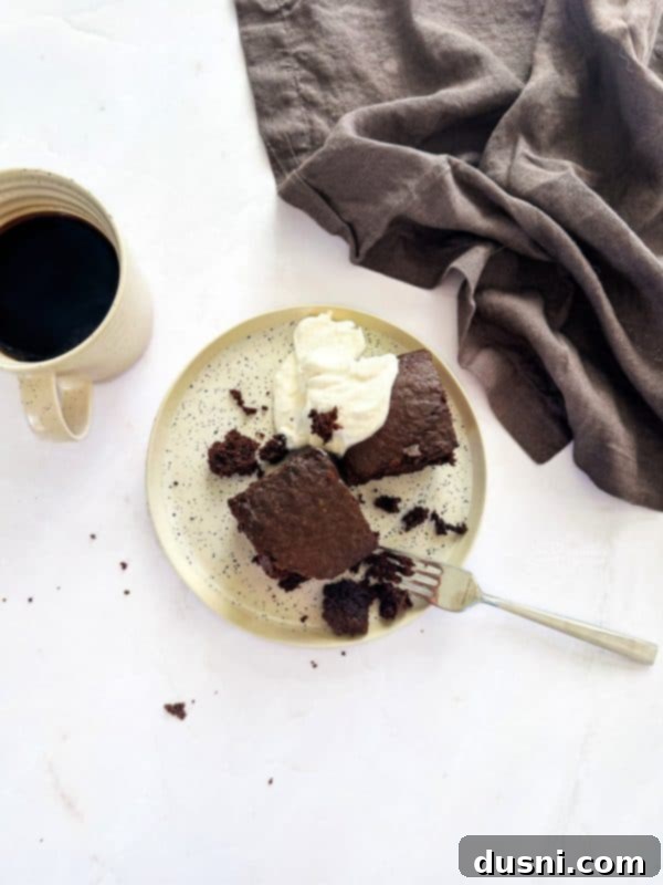 Simple Comfort Bake 12 Chocolate Depression Cake with powdered sugar and berries.