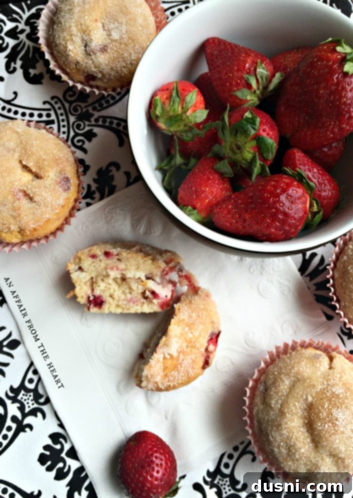 Irresistible Strawberry Cheesecake Muffins 3 Close-up of a Strawberry Cheesecake Muffin showing the beautiful crumb and filling.