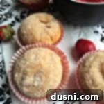 Irresistible Strawberry Cheesecake Muffins 9 close up of muffins with text "Strawberry Cheesecake Muffins"